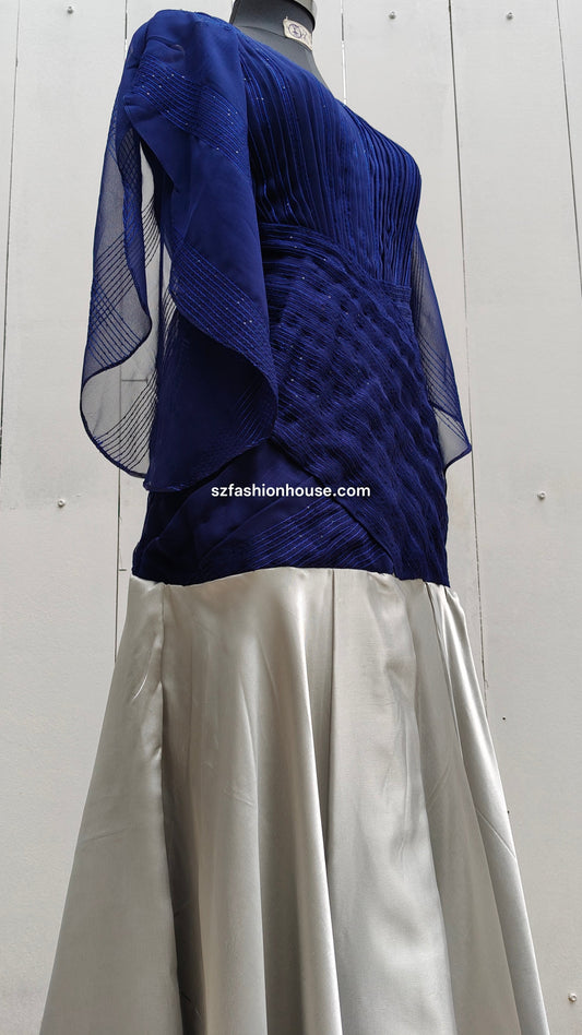Navy blue top and silver skirt on a mannequin against a white background