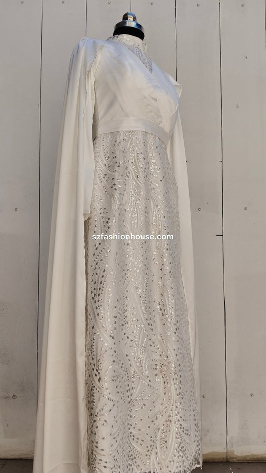 a long, light-colored dress with a sheer overlay , gown, white , wedding dress, wedding gown