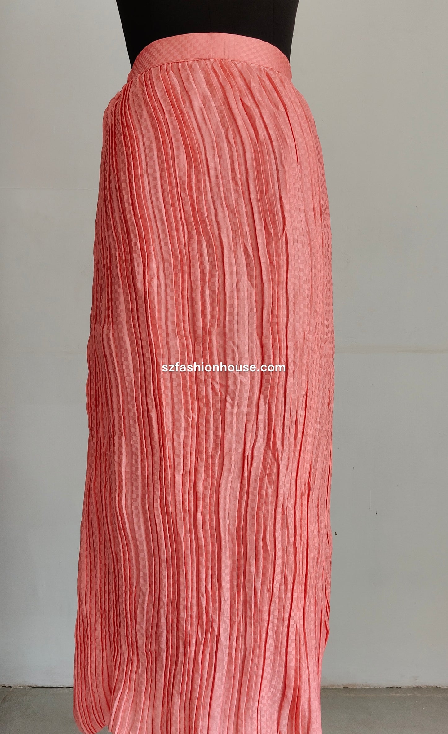 Pink pleated skirt on a plain background with 'szfashionhouse.com' branding.