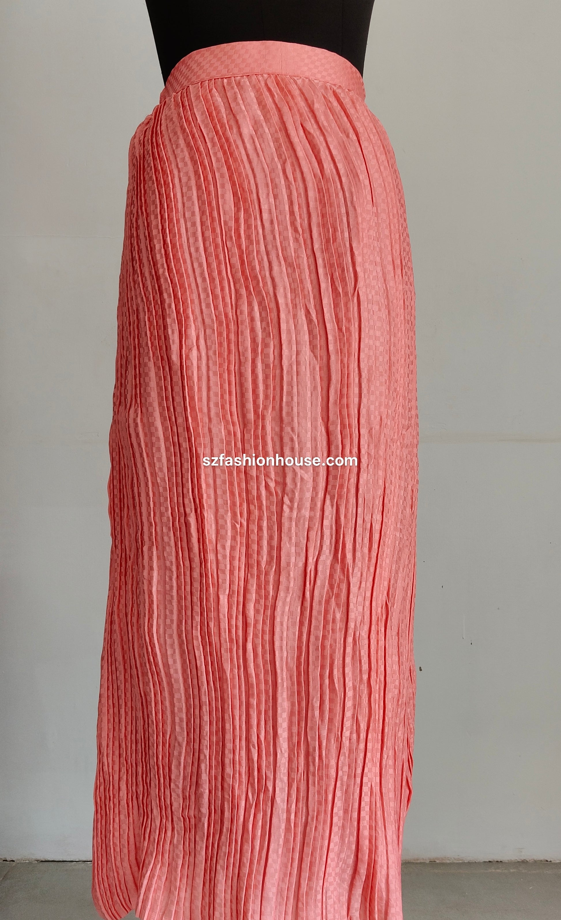Pink pleated skirt on a plain background with 'szfashionhouse.com' branding.