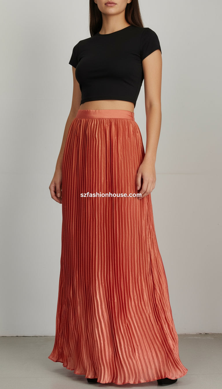 Long pleated skirt with a textured pattern on a plain background