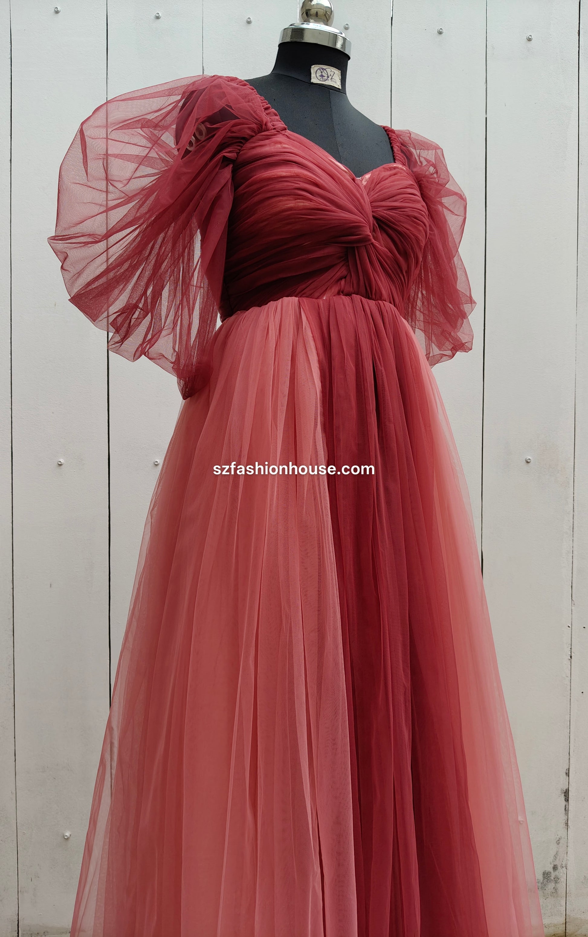 Red evening gown with sheer sleeves 