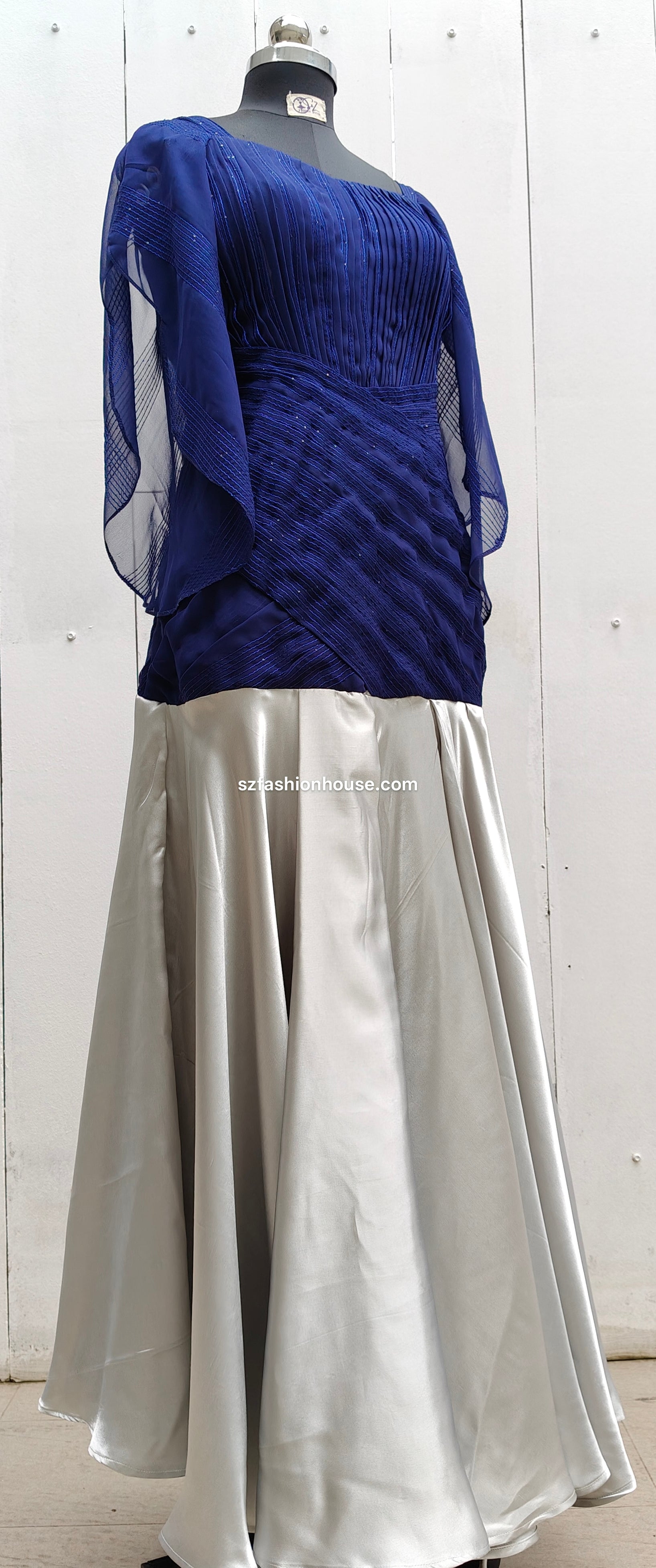 Blue top and silver skirt 