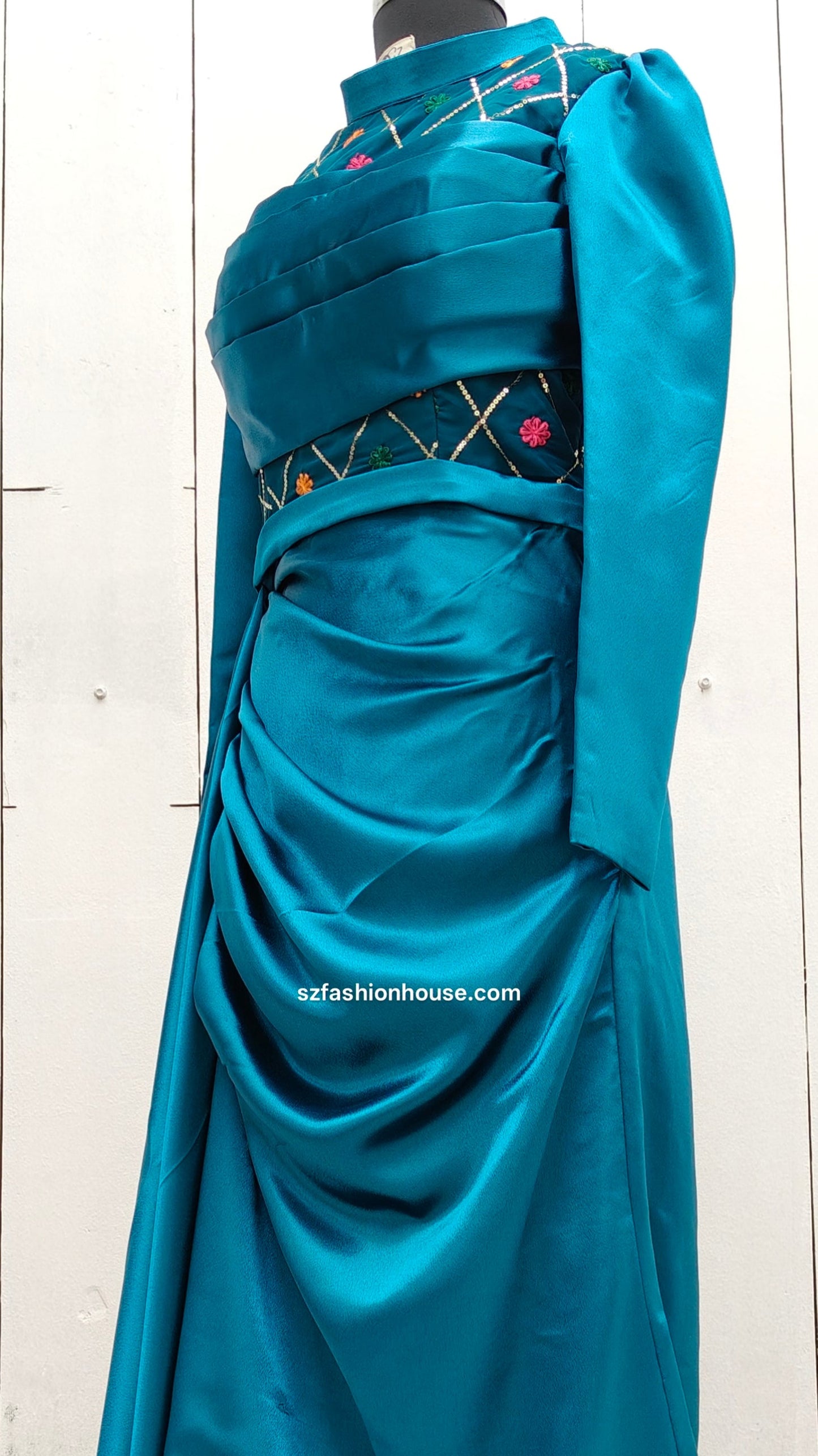 Teal evening gown with intricate detailing