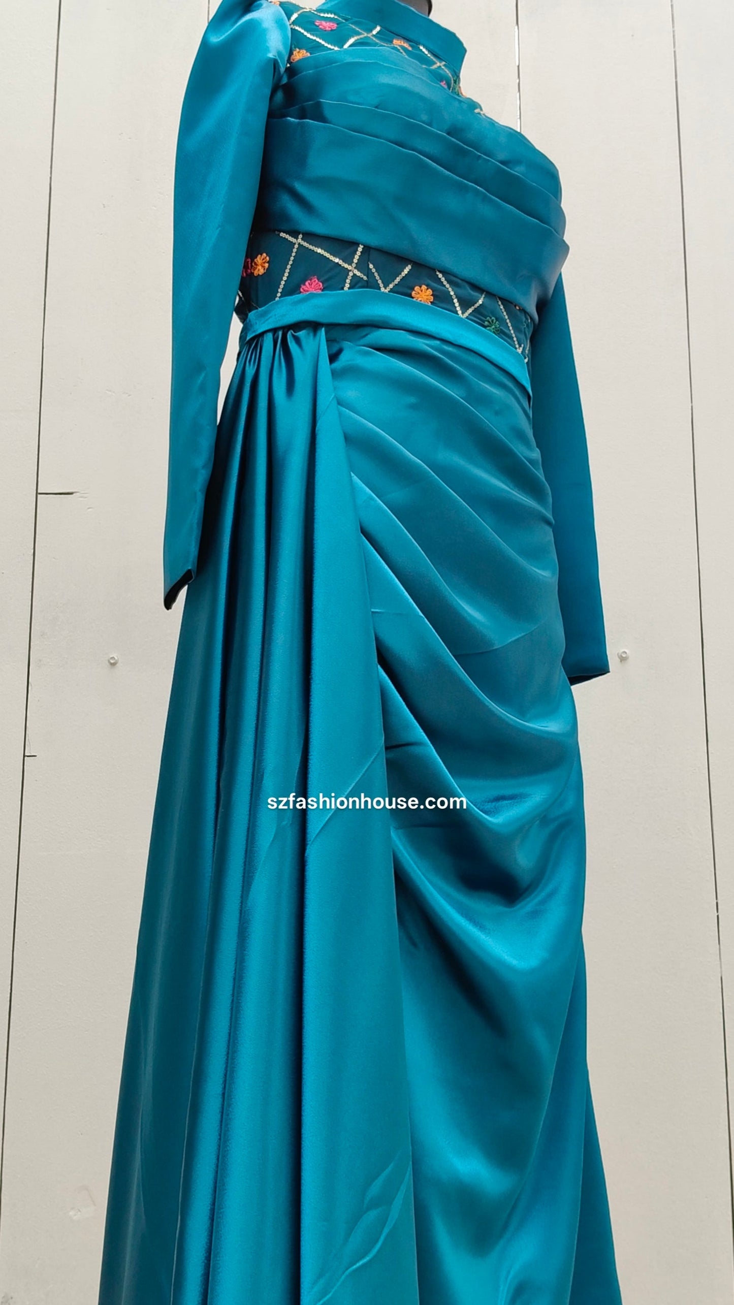 Teal gown with decorative elements 