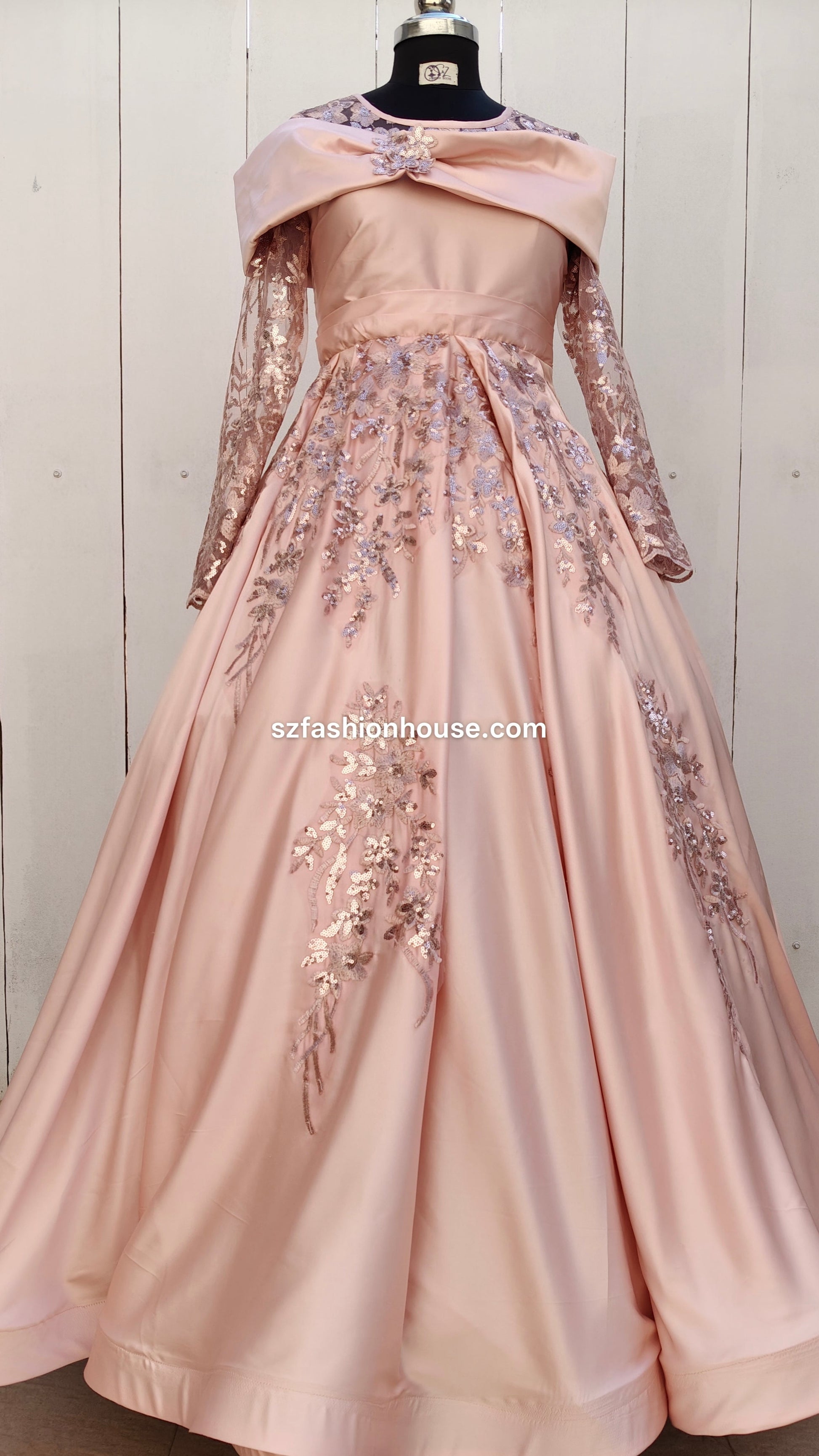 Pink evening gown with floral embellishments 