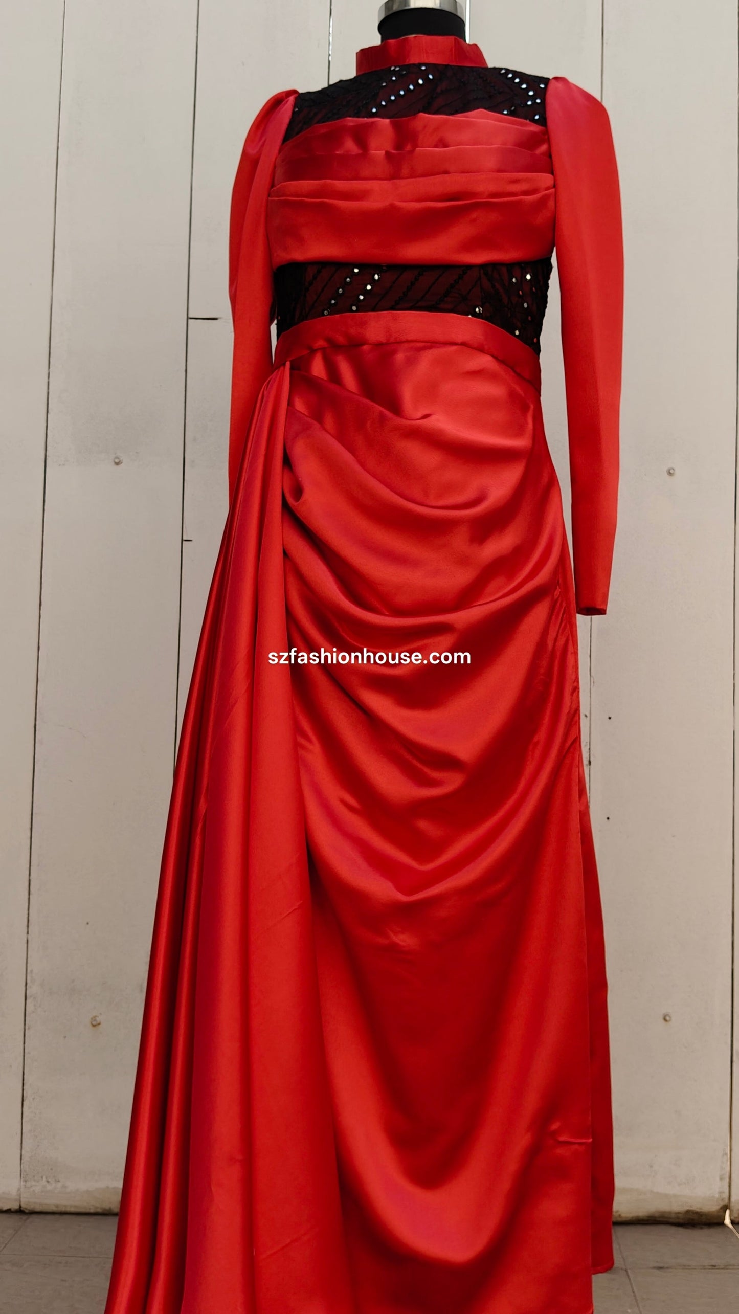 Red evening gown with black embellishments 