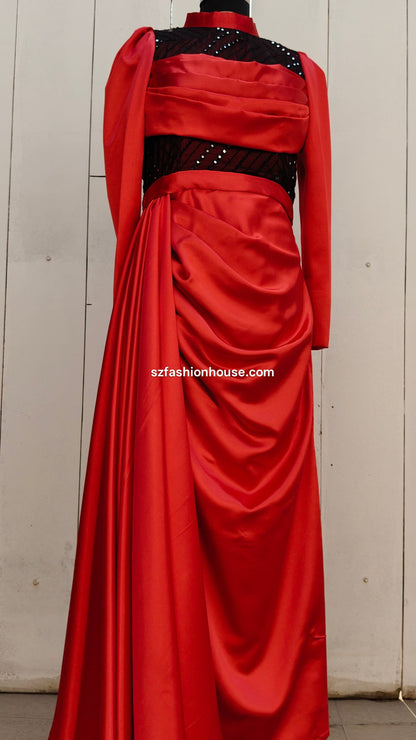 Red evening gown with black embellishments