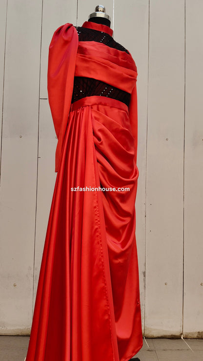 Red evening gown with black embellishments 