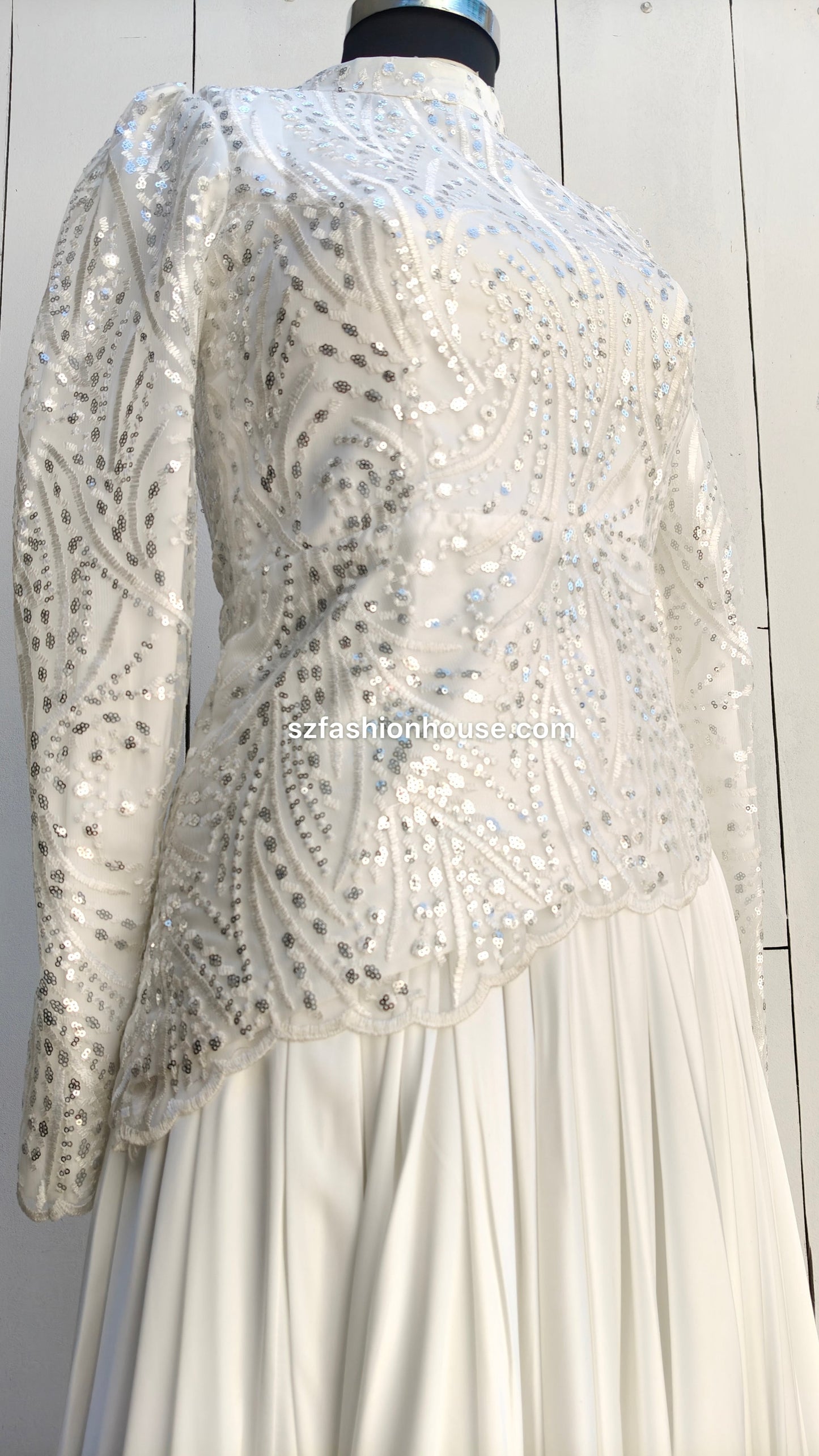  white dress with a sequined jacket 
