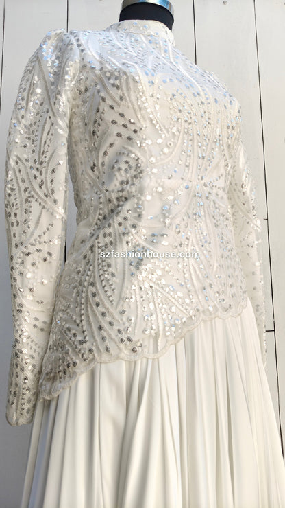  white dress with a sequined jacket 