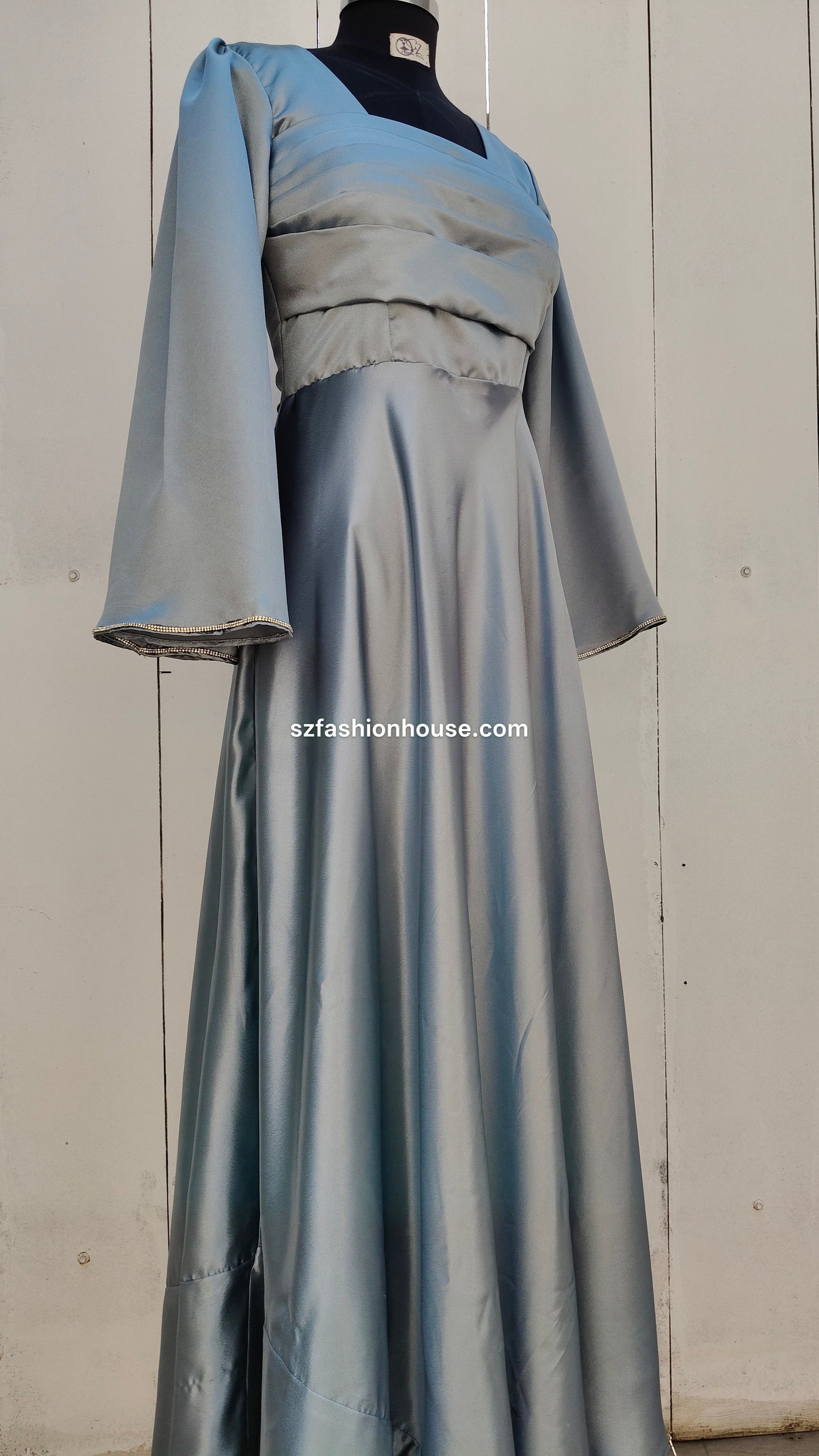 light silver designer gown, satin party wear gown, elegant silver gown for women, long sleeve designer dress, reception gown for women, wedding guest gown, luxury satin gown India, flared evening gown, modest designer gown, premium party wear dress, S&Z Fashion House gown, stylish silver maxi gown, engagement wear gown, women’s designer gown online India,
online shopping, muslim, islam, christian, full cover