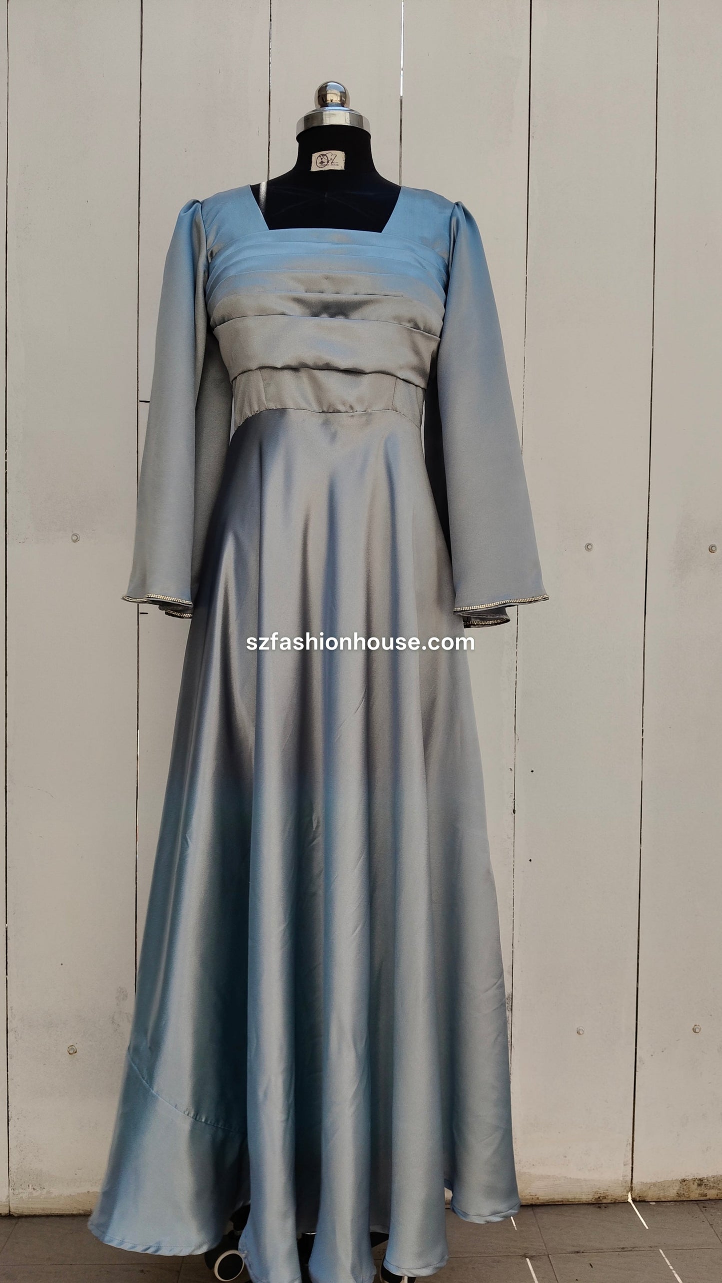 light silver designer gown, satin party wear gown, elegant silver gown for women, long sleeve designer dress, reception gown for women, wedding guest gown, luxury satin gown India, flared evening gown, modest designer gown, premium party wear dress, S&Z Fashion House gown, stylish silver maxi gown, engagement wear gown, women’s designer gown online India,
online shopping, muslim, islam, christian, full cover