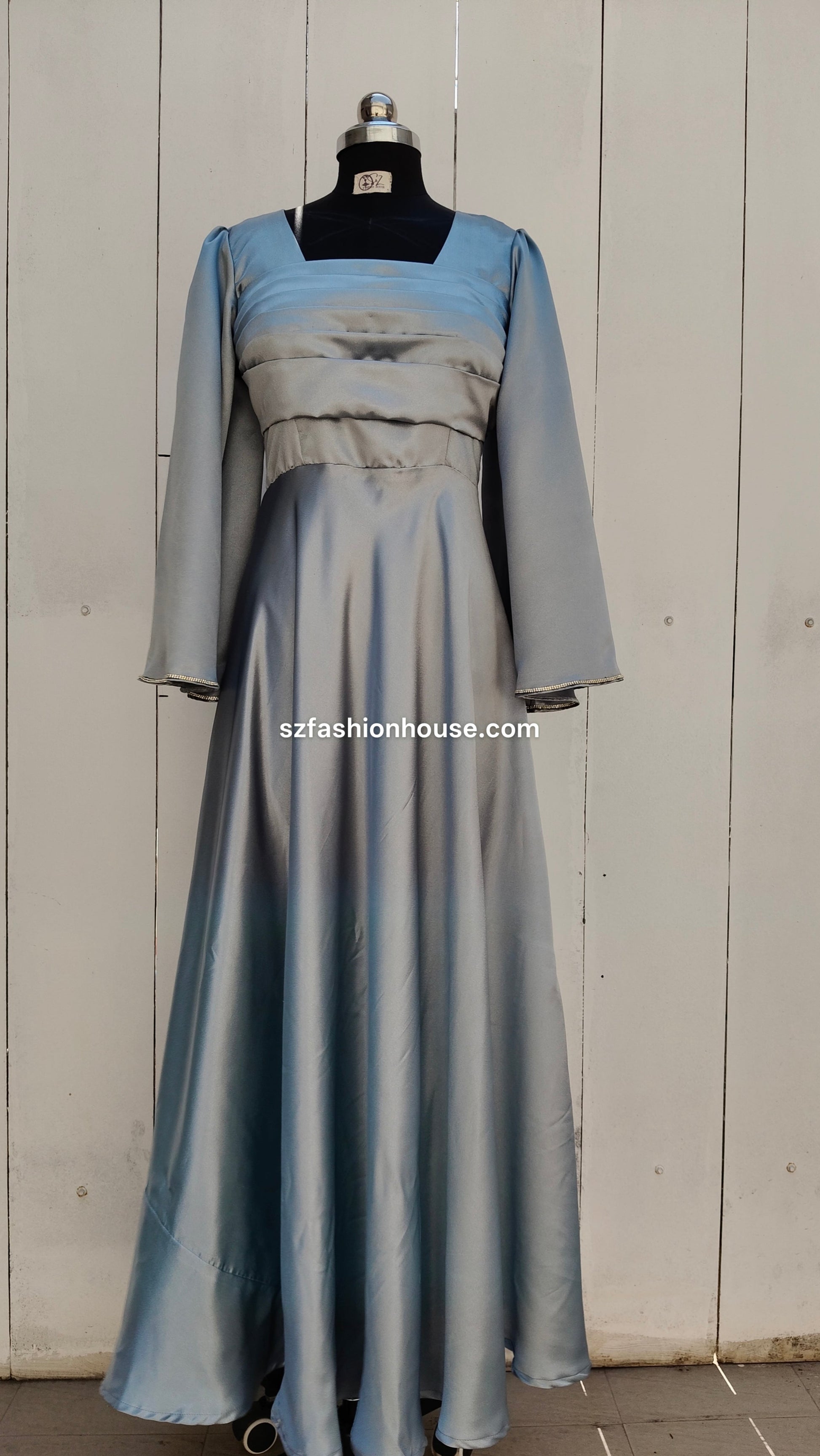 light silver designer gown, satin party wear gown, elegant silver gown for women, long sleeve designer dress, reception gown for women, wedding guest gown, luxury satin gown India, flared evening gown, modest designer gown, premium party wear dress, S&Z Fashion House gown, stylish silver maxi gown, engagement wear gown, women’s designer gown online India,
online shopping, muslim, islam, christian, full cover