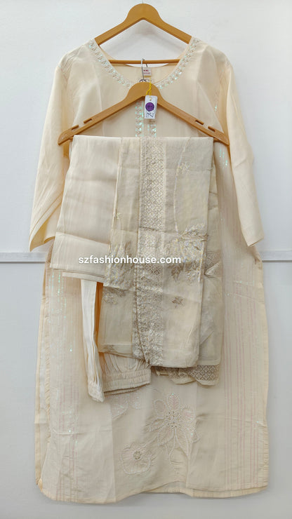 Beige traditional outfit with embroidered details 