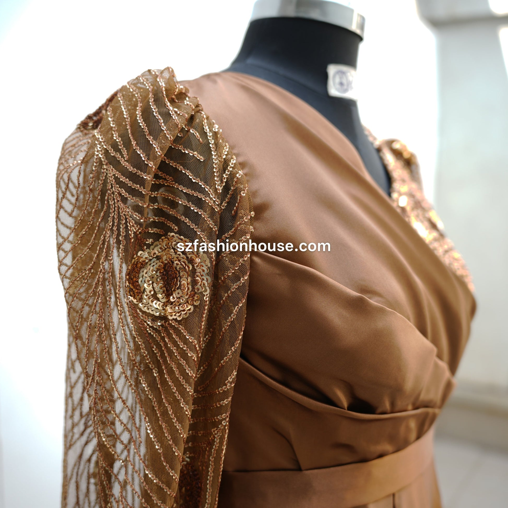 brown designer gown, satin evening gown for women, luxury party wear gown, embellished sleeve gown, elegant brown maxi dress, wedding guest gown India, reception wear gown, satin flare gown, designer long gown for women, premium evening dress, modest party wear gown, S&Z Fashion House gown, engagement party dress, stylish satin gown online India, modest gown