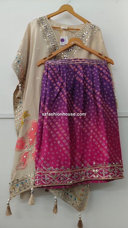 Traditional outfit with embroidered top and sharara patterned pant