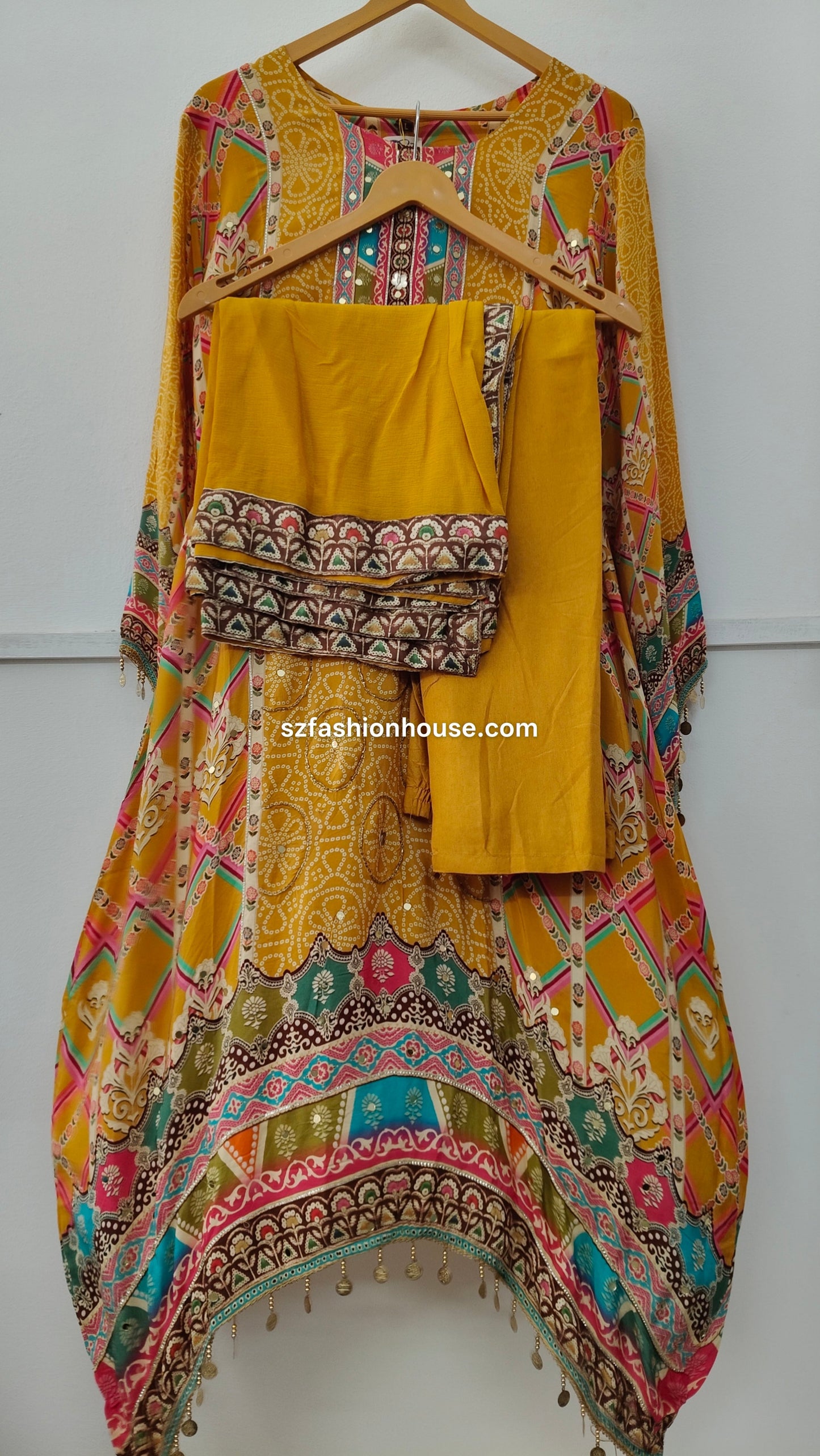 Traditional outfit with a yellow top , pant and dupatta